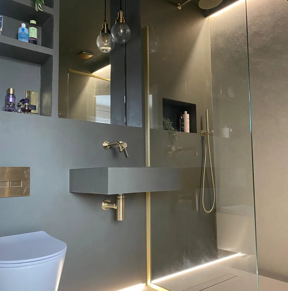 Walk-in shower with floating basin and brushed brass fittings, installed by Macaulay Plumbing, plumber in Waterlooville